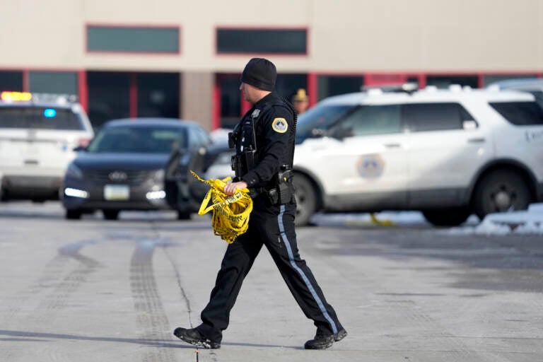 A law enforcement officer walks outside the Starts Right Here building, Monday, Jan. 23, 2023, in Des Moines, Iowa