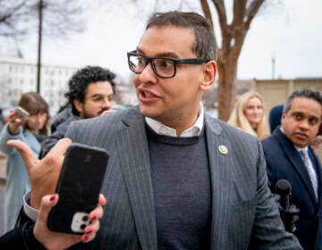 Rep. George Santos, R-N.Y., leaves a House GOP conference meeting on Capitol Hill