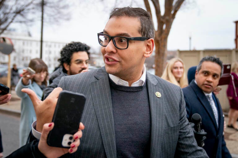 Rep. George Santos, R-N.Y., leaves a House GOP conference meeting on Capitol Hill