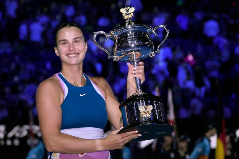 Aryna Sabalenka of Belarus holds the Daphne Akhurst Memorial Trophy after defeating Elena Rybakina