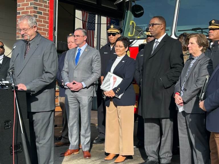 U.S. Fire Administrator Lori Moore-Merrell (center) stands with city officials and representatives of national fire safety organizations at a press event in Philly Wednesday. (Sophia Schmidt/WHYY)