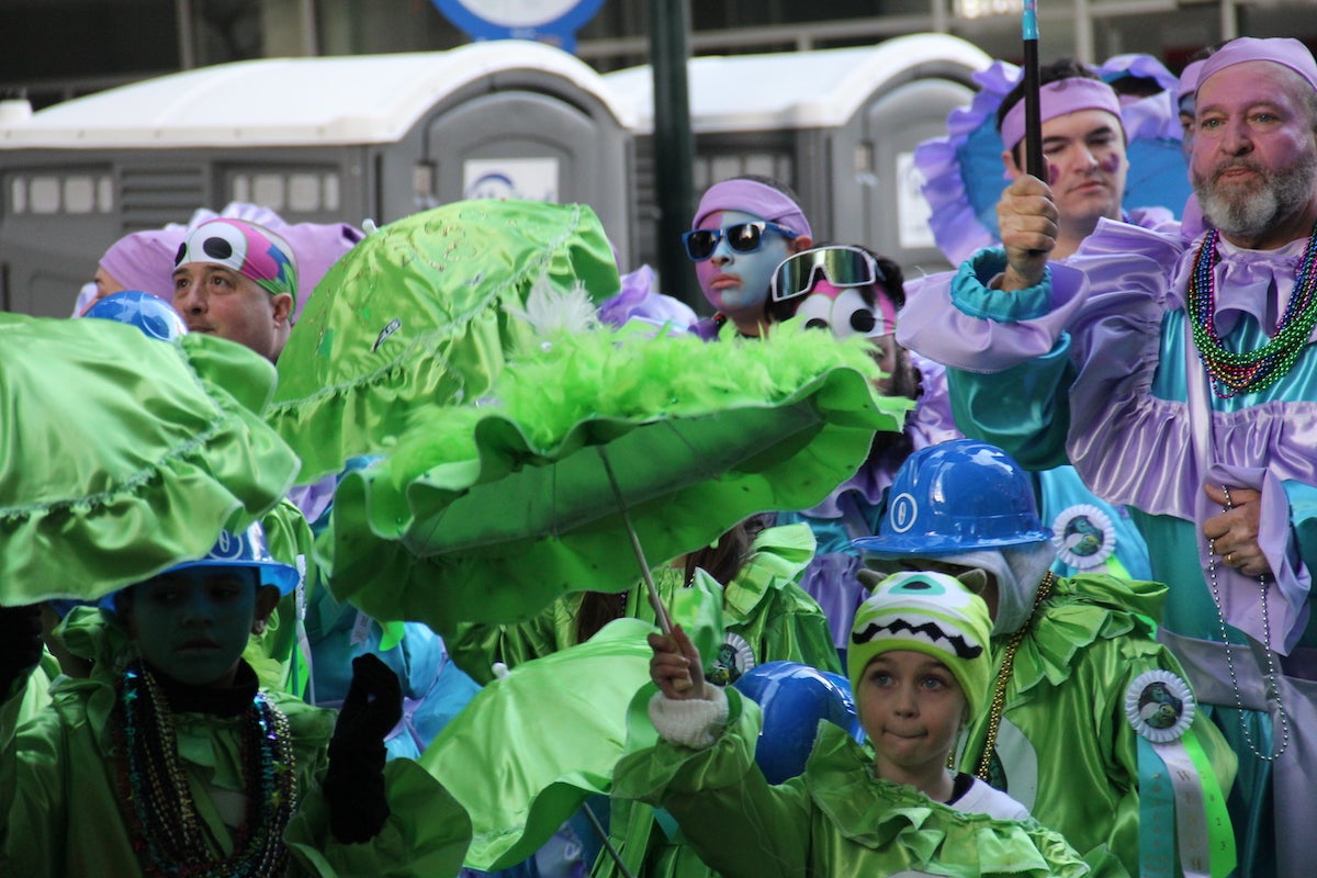 Thousands of people participate in the Mummers Parade each year, including this group who wore costumes inspired by Disney's Monsters Inc. on Jan. 1, 2023. (Cory Sharber/WHYY)