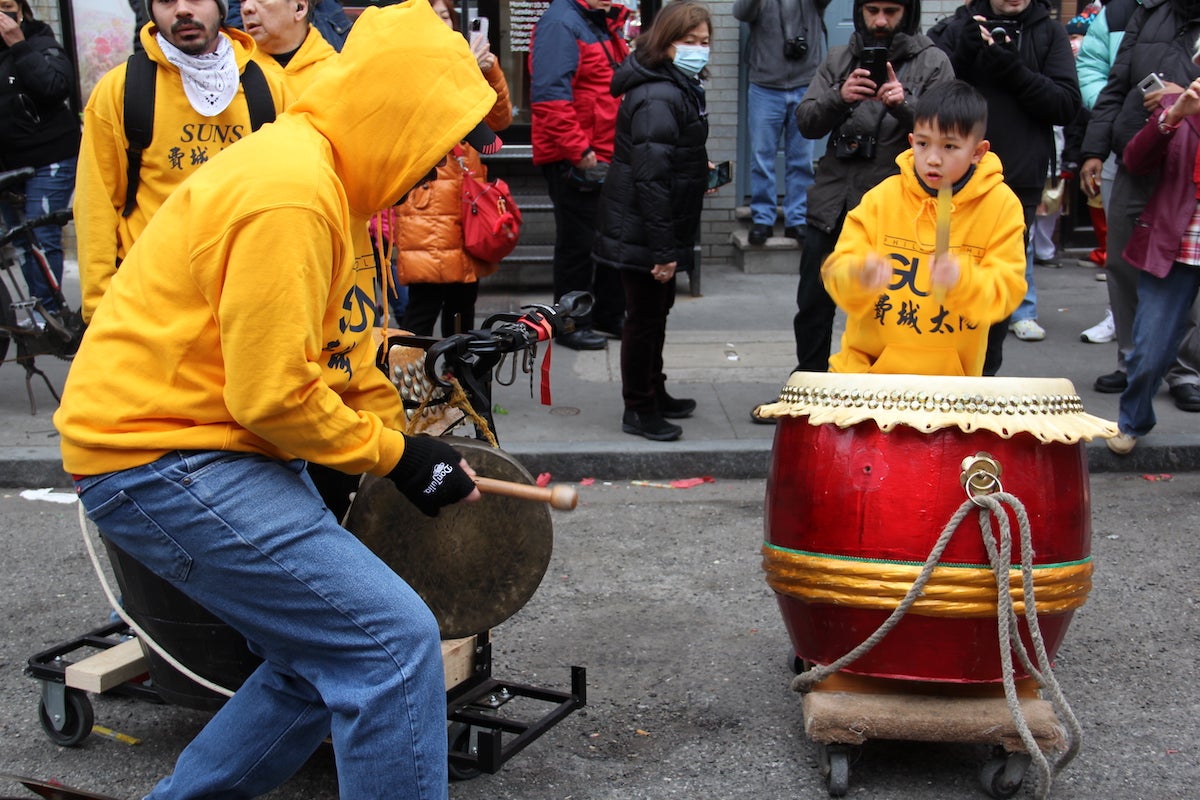 Generations of Philadelphians celebrated the Lunar New Year with music, fireworks, and dancing lions through the streets of Chinatown on Jan. 22, 2023. (Cory Sharber/WHYY)