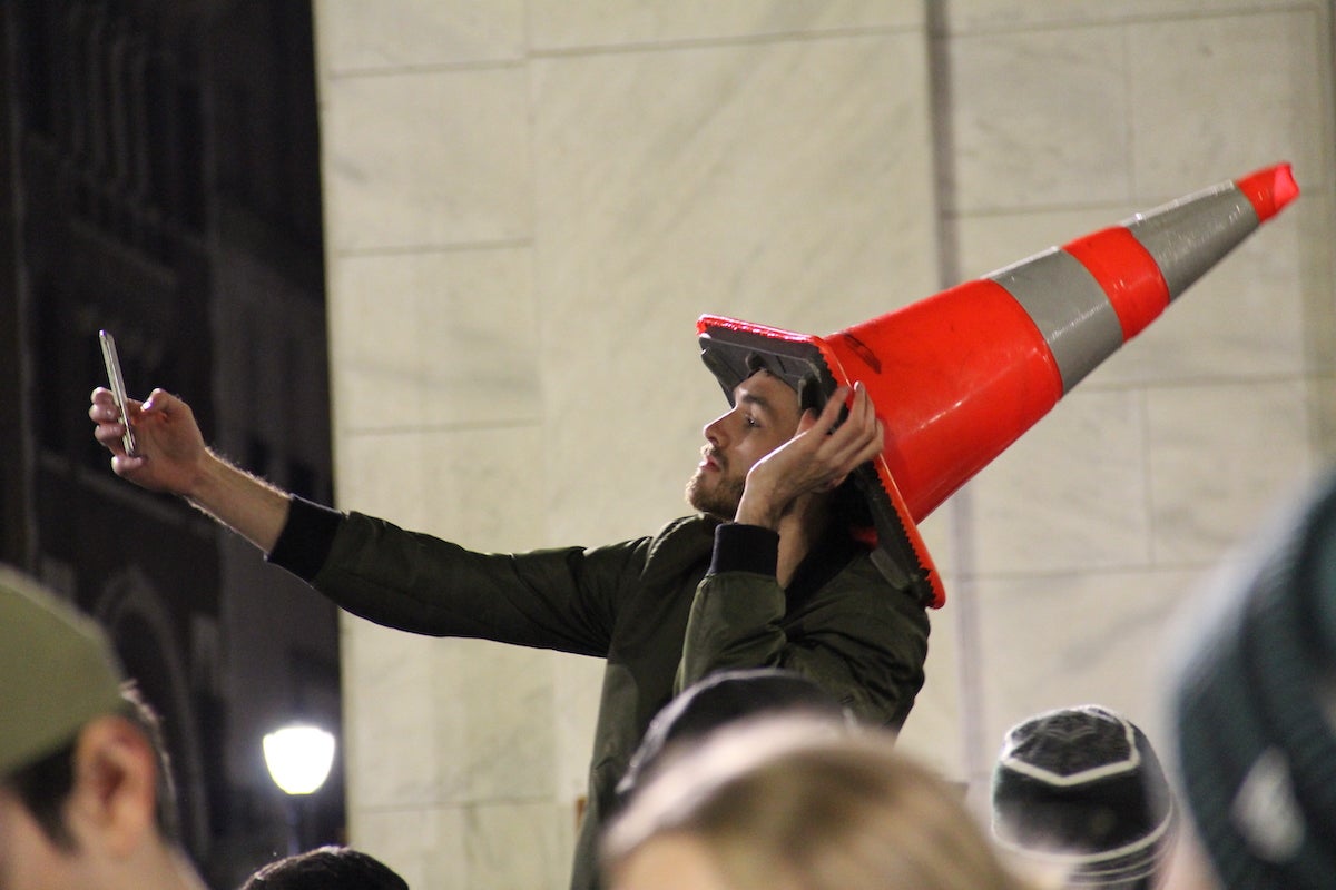 This fan was seen modeling a traffic cone as an accessory Sunday night