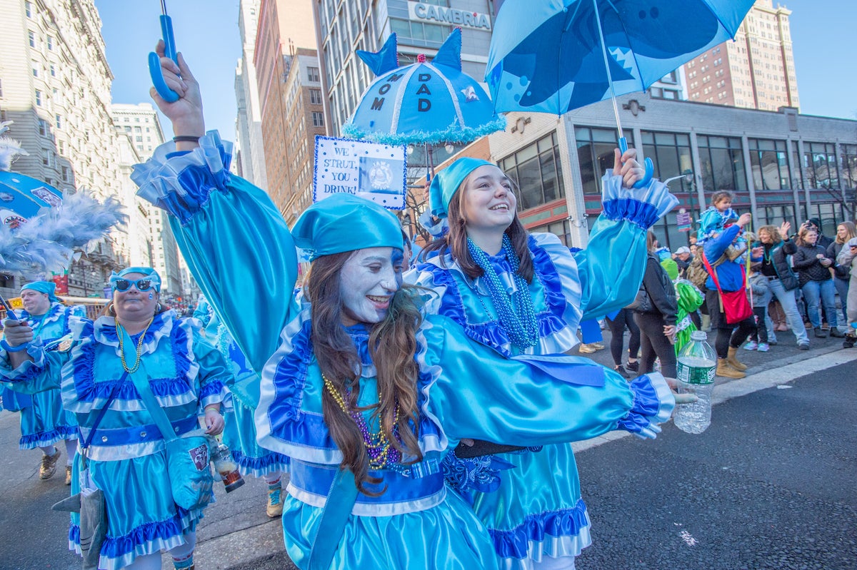 Bryson Wench Brigade members Chelsea Haigh, left and Virginia Payne dance along South Broad St. (Jonathan Wilson for WHY)