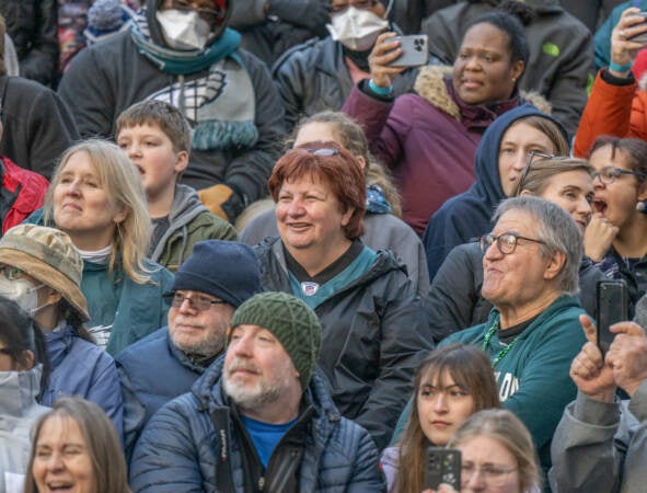 Crowds in the bleachers by the judges stands outside of City Hall enjoy a performance by Golden Sunrise Nya. (Jonathan Wilson for WHY)