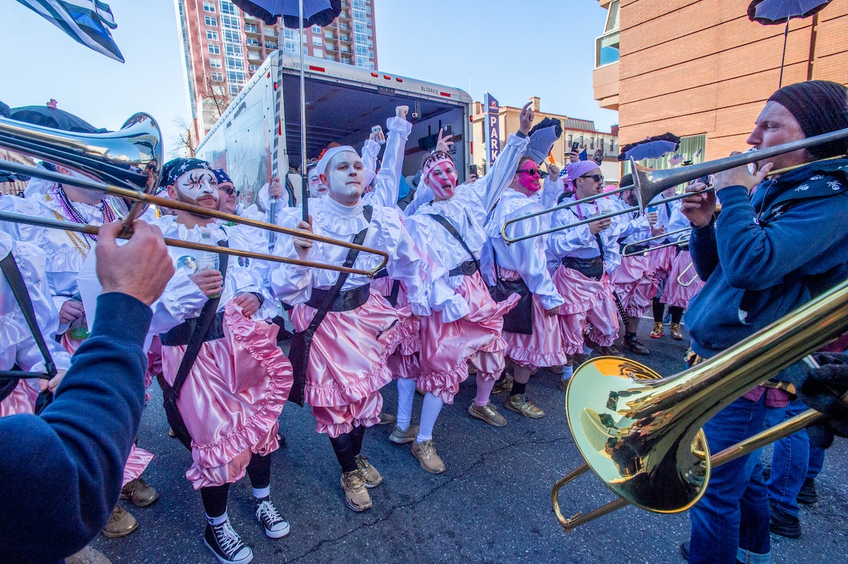 Members of the Pirates Wench Brigade dance to Golden Slippers played by the Whoa Phat Brass Band. Both groups are bassed in South Philadelphia. (Jonathan Wilson for WHY)