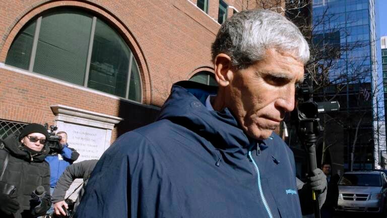 Rick Singer departs federal court in Boston in March 2019 after pleading guilty to charges in a nationwide college admissions bribery scandal. Singer is scheduled to be sentenced Wednesday afternoon in Boston. (Steven Senne/AP)