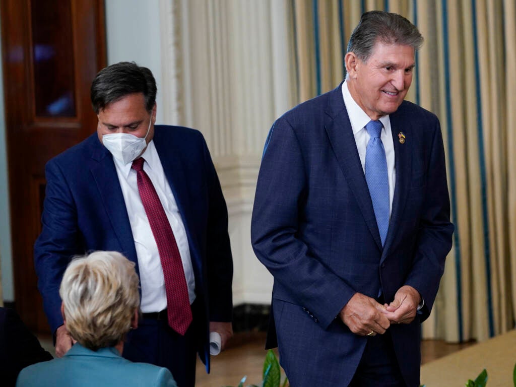 Sen. Joe Manchin, D-W.Va., arrives followed by White House chief of staff Ron Klain 