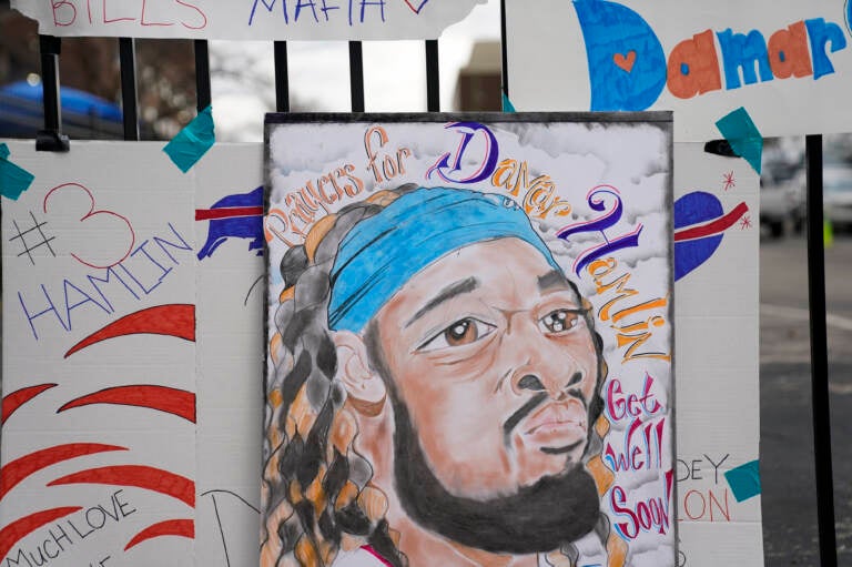 An artist's portrait of Buffalo Bills safety Damar Hamlin is displayed Thursday outside UC Medical Center, where the 24-year-old remains hospitalized. (Joshua A. Bickel/AP)