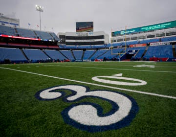 The 30-yard line at Highmark Stadium in Buffalo bears a stylized number 3 in support of Buffalo Bills safety Damar Hamlin.