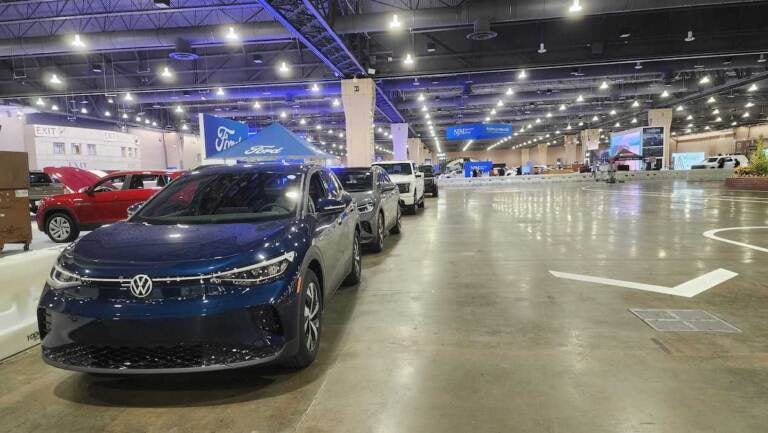 A line of electric vehicles on display.