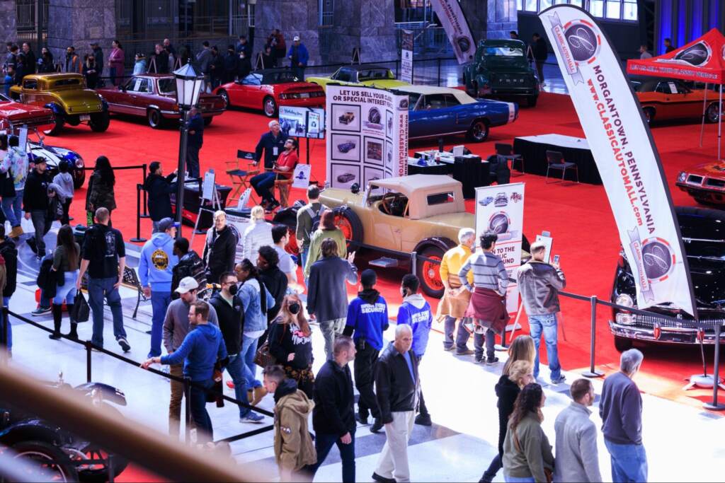 People mill about at the auto show in Philadelphia.