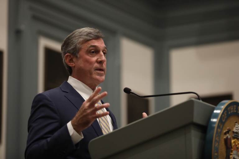 An upclose shot of Gov. John Carney speaking at a podium.