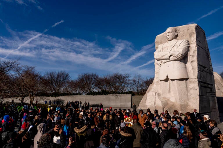 A large group gathers to watch a wreath-laying ceremony at the Martin Luther King Jr. Memorial