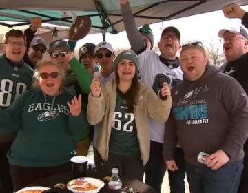 A group of Eagles fans pose for a photo.