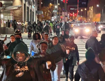 Fans pour onto North Broad Street, with many heading toward City Hall. (Mark Henninger/Imagic Digital)