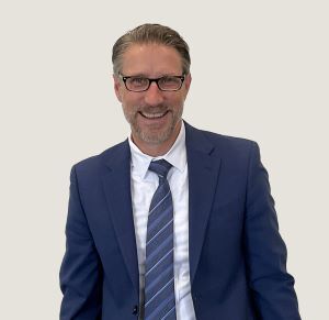 Headshot of Mark Holodick smiling.