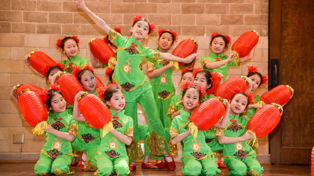 A group of dancers pose for a photo.