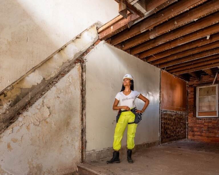 Monica Miraglilo poses on a construction site