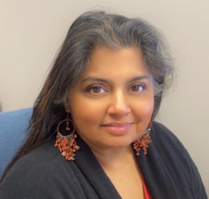 A headshot of Purnima Montagne smiling.