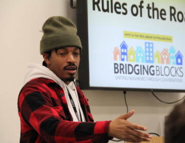 Amir Richardson gestures as he leads a community conversation.