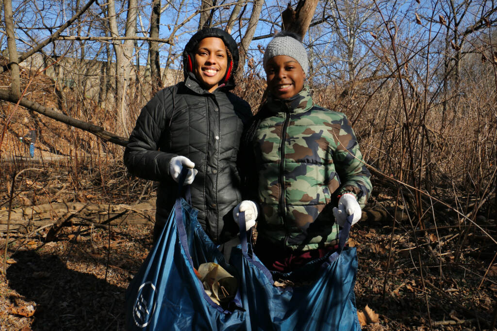 Shelley Henderson (left) and her daughter, Jaylynn Chalmers, 13, work together to clean up Tacony Creek Park