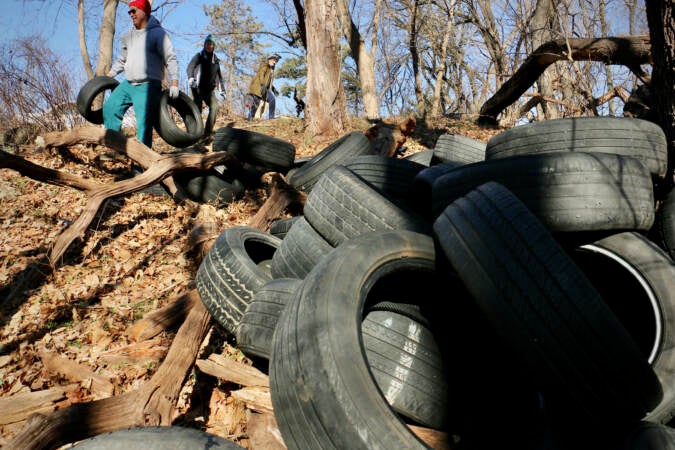 Hundreds of tires are seen near Tacony Creek Park