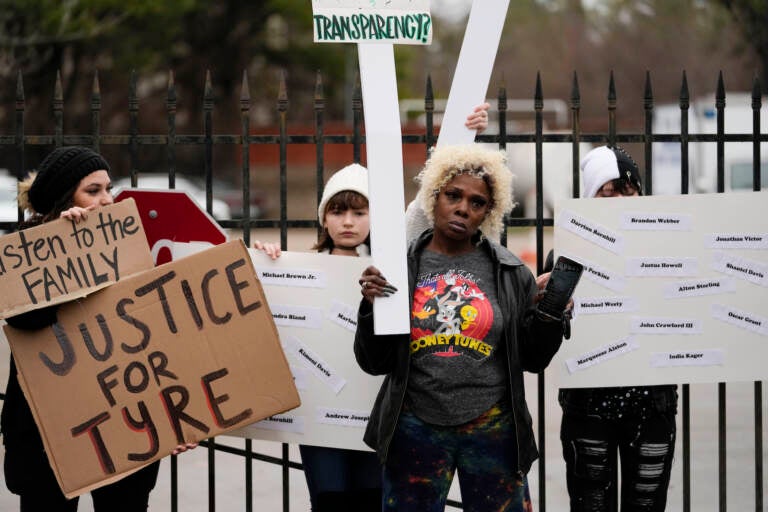 A group of demonstrators protest outside a police precinct in response to the death of Tyre Nichols, who died after being beaten by Memphis police officers, in Memphis, Tenn., Sunday, Jan. 29, 2023. (AP Photo/Gerald Herbert)