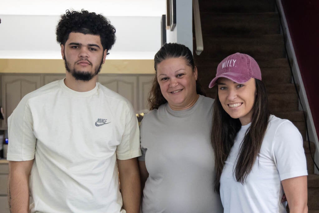 Ivan Cuevas, Natali Rosario, and Rihannon Hope pose for a photo.