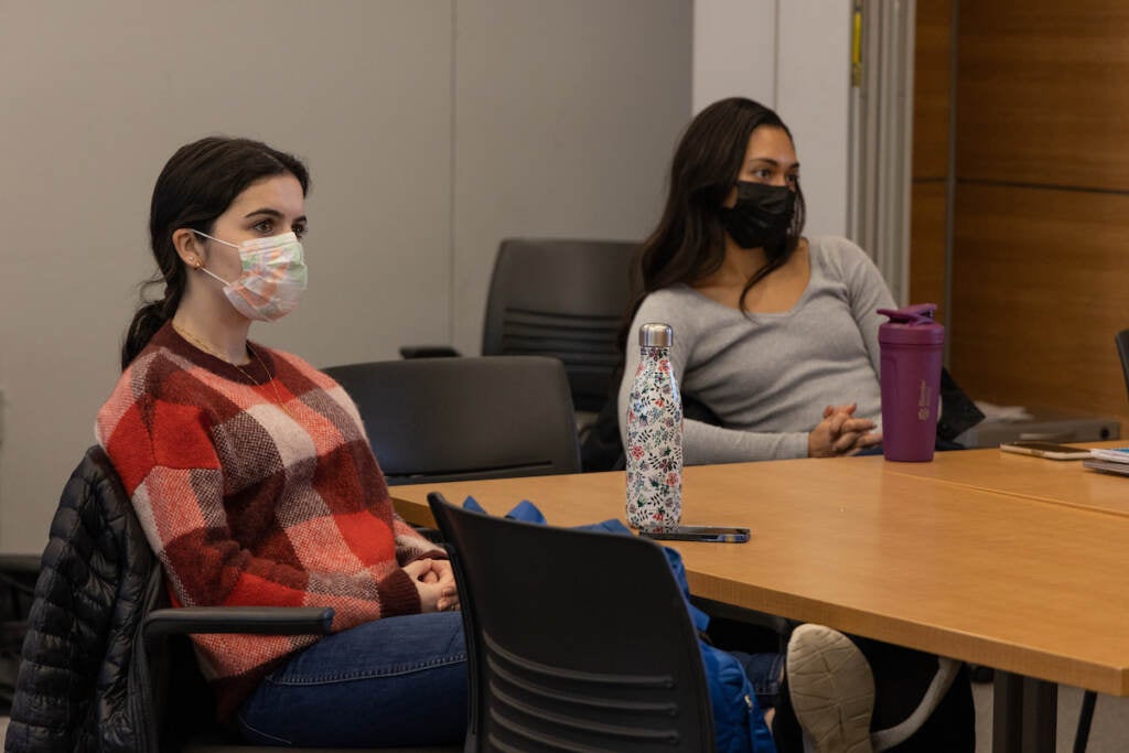 Students look towards the front of the room.