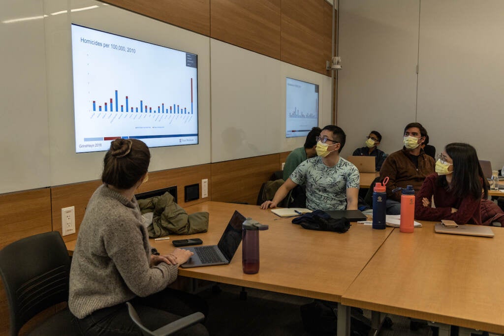 Students look at a presentation.