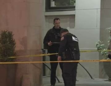 Police inspect an area in Center City, cordoned off with Police tape