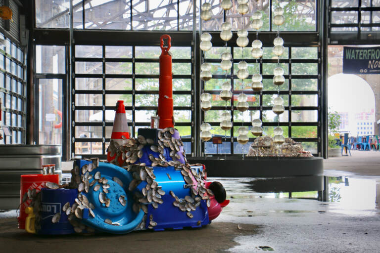 File - In 2022 The Cherry Street Pier  hosted ''Freshwater,'' a sculptural fountain by Jean Shin that uses Delaware River water and living freshwater mussels. Other sculptural elements were made from recycled plastic and shells collected from the Delaware. (Emma Lee/WHYY)