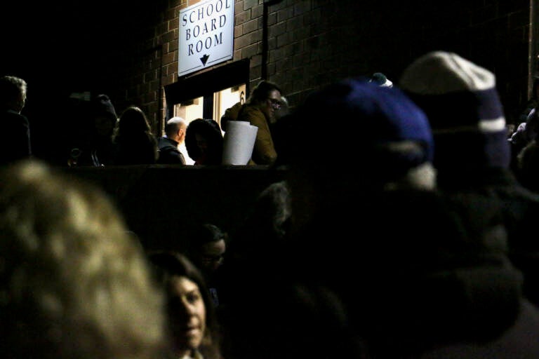 People line up to attend a Central Bucks School Board meeting In Doylestown, Pa. (Emma Lee/WHYY)