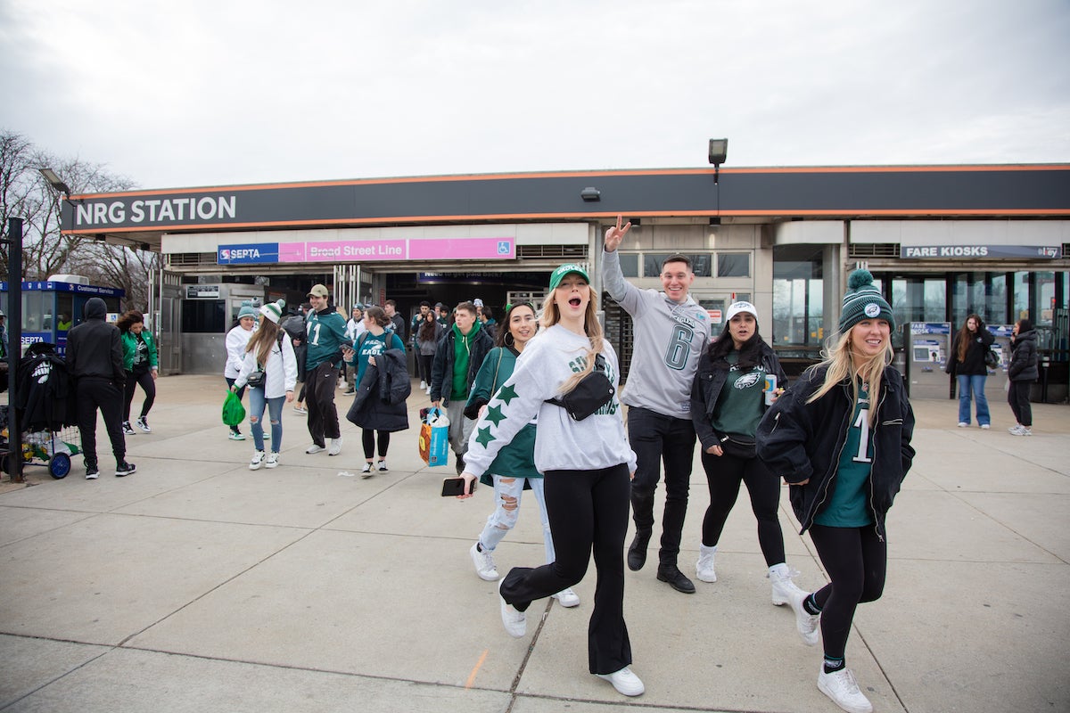 Fans stream out of NRG Station as they head to Xfinity Live! to watch the Philadelphia Eagles play the Kanas City Chiefs in Super Bowl LVII. (Emily Cohen for WHYY)