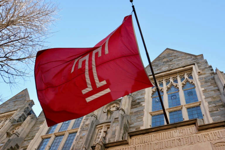 A flag flies on Temple University's Sullivan Hall. (Emma Lee/WHYY)