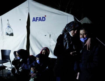 People in Antakya, Turkey, react after a new earthquake struck on Monday. (Clodagh Kilcoyne/Reuters)