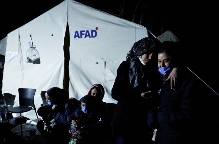 People in Antakya, Turkey, react after a new earthquake struck on Monday. (Clodagh Kilcoyne/Reuters)