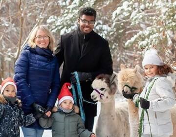 Tatiana Poladko and Atnre Alleyne pose with their family