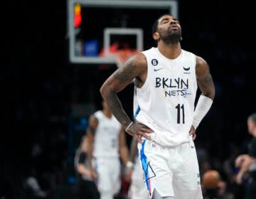 Brooklyn Nets' Kyrie Irving reacts during the second half of the team's NBA basketball game against the Detroit Pistons