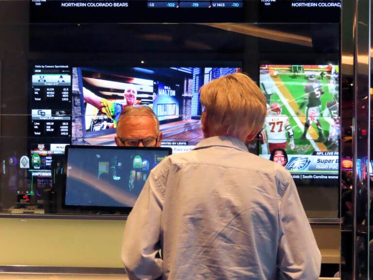 A customer (right) makes a sports bet at the Ocean Casino Resort in Atlantic City, N.J., Monday, Feb. 6, 2023