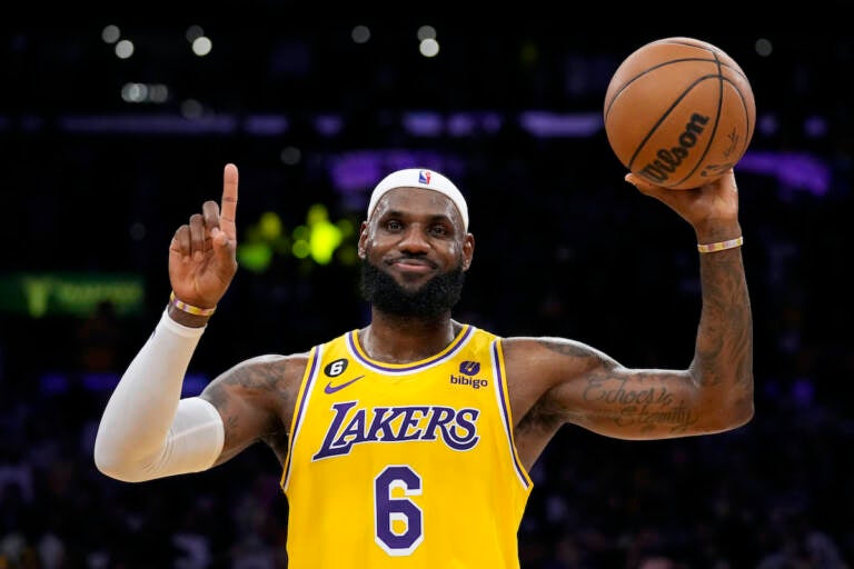 Los Angeles Lakers forward LeBron James gestures after passing Kareem Abdul-Jabbar to become the NBA's all-time leading scorer during the second half of an NBA basketball game against the Oklahoma City Thunder