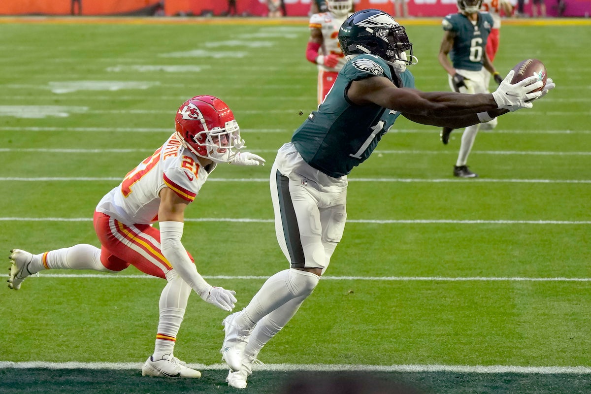 Philadelphia Eagles wide receiver A.J. Brown (11) makes the touchdown catch against Kansas City Chiefs cornerback Trent McDuffie (21) during the first half of the NFL Super Bowl 57 football game between the Kansas City Chiefs and the Philadelphia Eagles, Sunday, Feb. 12, 2023, in Glendale, Ariz. (AP Photo/Seth Wenig)