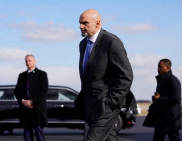 FILE - Sen. John Fetterman, D-Pa., walks to a motorcade vehicle after stepping off Air Force One behind President Joe Biden, Feb. 3, 2023, at Philadelphia International Airport in Philadelphia. On Thursday, Feb. 16, Fetterman's office announced that the senator had checked himself into the hospital for clinical depression.(AP Photo/Patrick Semansky, File)