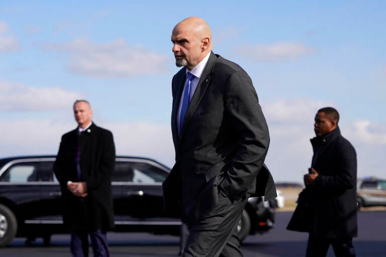 FILE - Sen. John Fetterman, D-Pa., walks to a motorcade vehicle after stepping off Air Force One behind President Joe Biden, Feb. 3, 2023, at Philadelphia International Airport in Philadelphia. On Thursday, Feb. 16, Fetterman's office announced that the senator had checked himself into the hospital for clinical depression.(AP Photo/Patrick Semansky, File)