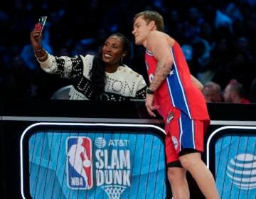 Lisa Leslie takes a selfie with Mac McClung of the Philadelphia 76ers during the slam dunk competition of the NBA basketball All-Star weekend