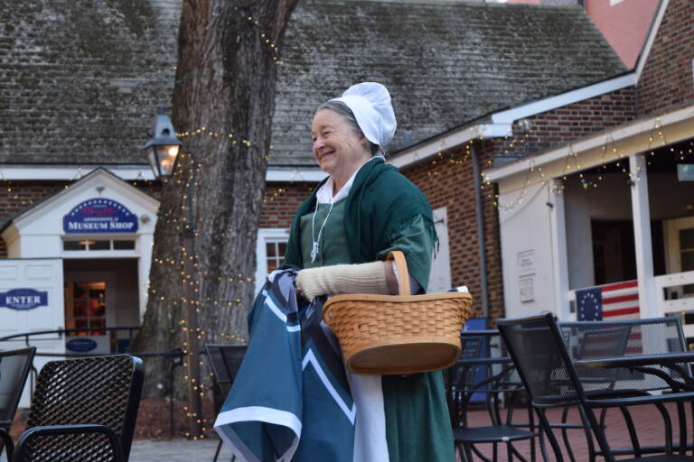 Betsy Ross impersonator Carol Spacht waiting to greet the Eagles fans before putting up the Eagles flag. (Ella Lathan/WHYY)