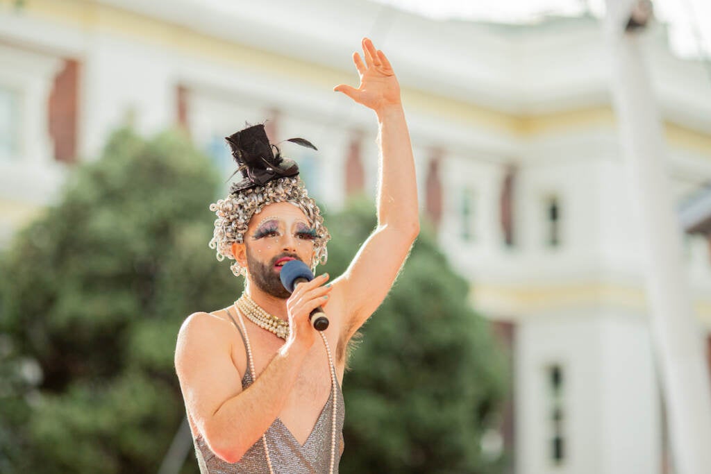 John Jarboe raises up her arm as she performs.