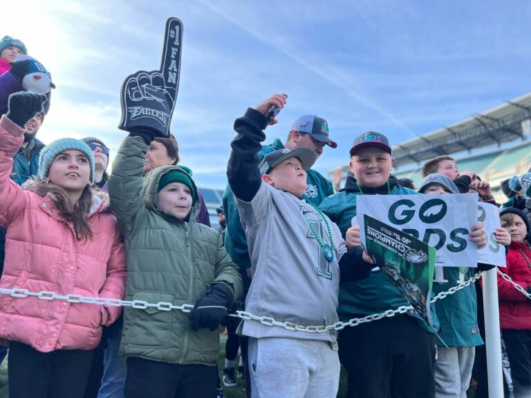 Eagles fans get fired up during the Eagles Super Bowl Send-off Party as they await the arrival of players and coaches